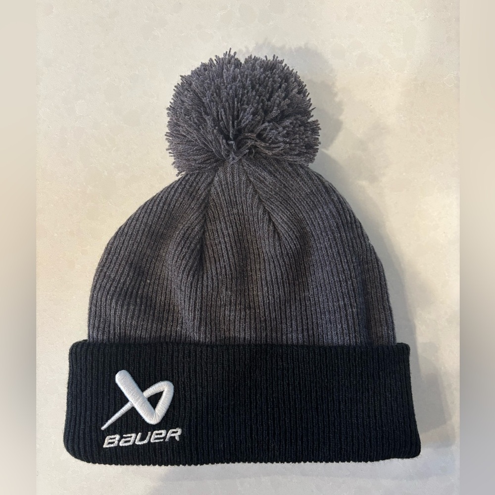 NWOT Bauer Hockey Black and Gray Knit Pom Pom Beanie. Child sized